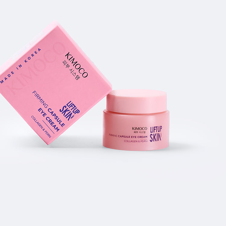 Zamknięty różowy słoiczek "Kimoco Lift-Up Skin Firming Capsule Eye Cream", na białym tle.